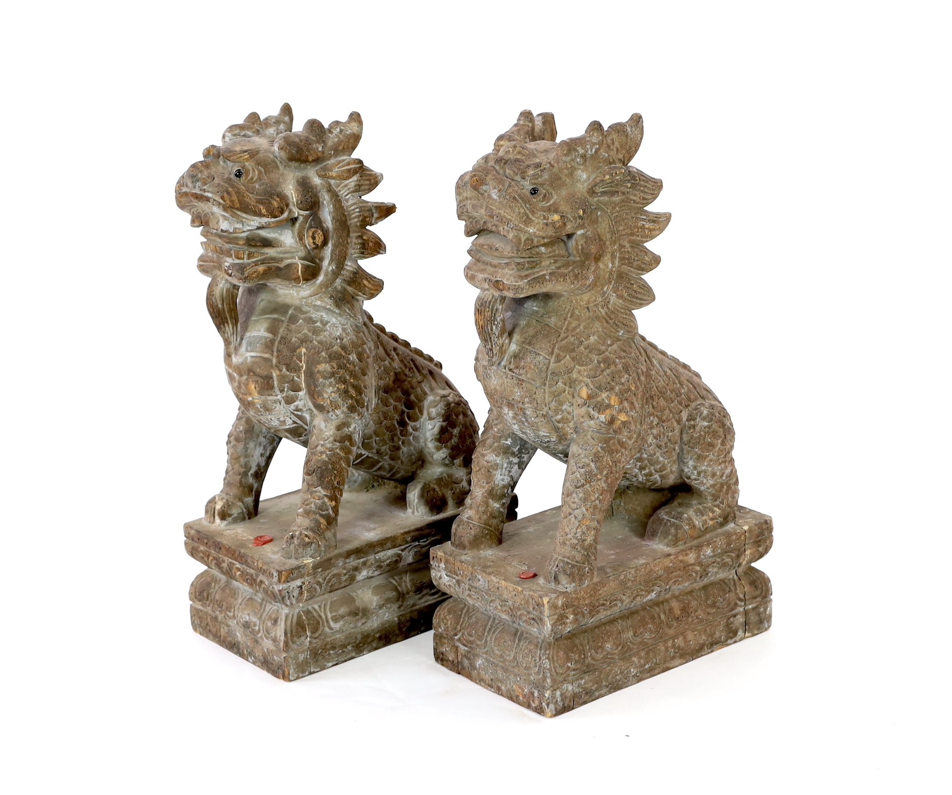 A pair of carved hardwood temple lions, height 69cm